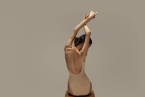 Young graceful tender ballerina on pastel studio background - Фото, изображение
