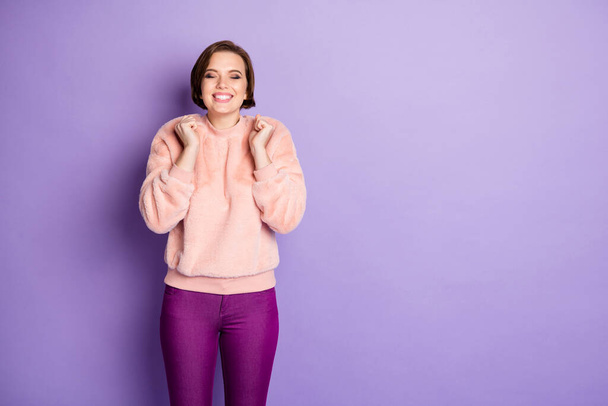 Portrait of content girl dream about desirable gift she get hold fists imagine close eyes feel glad emotions wear good looking outfit isolated over violet color background - Foto, Bild