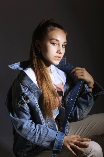 Teen girl in stylish clothes. Trend photos in 90s style. Toning photos with highlights. - Foto, afbeelding