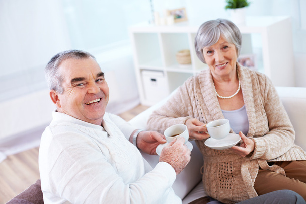 Mature man and his wife drinking tea - Photo, Image
