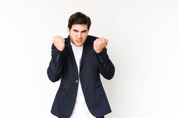 Young business man isolated on white background upset screaming with tense hands. - Фото, изображение