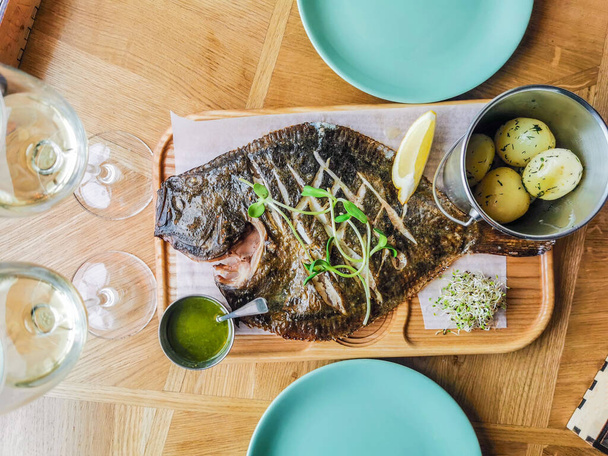 Baked flounder on table food background - Photo, image