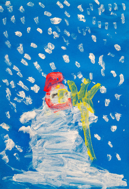 Child painting dedicated to winter time snowman with a snow falling down. - Photo, Image