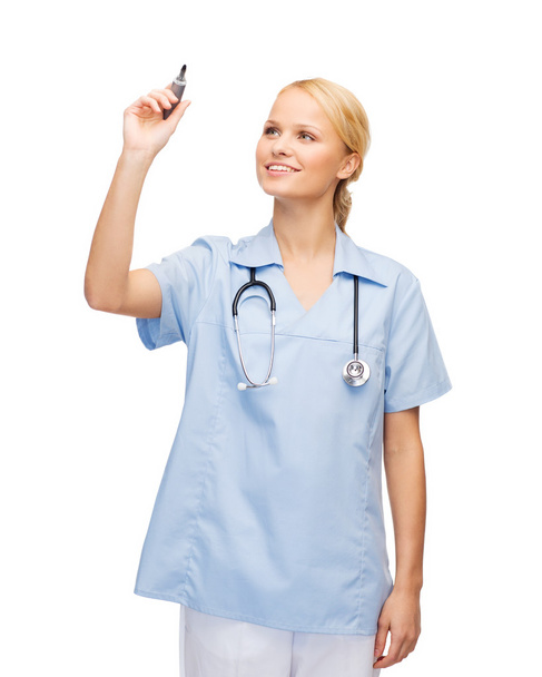 Doctor or nurse working with something imaginary - Foto, Bild
