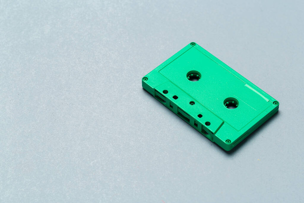 One single retro audio cassette on light grey background, top view - Foto, Bild