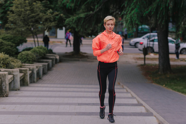 Healthy lifestyle athlete dressed in training clothes exercising - Photo, Image