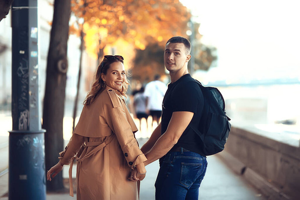 couple in love spring walk, boy and girl, city travel seasonal look - Fotografie, Obrázek