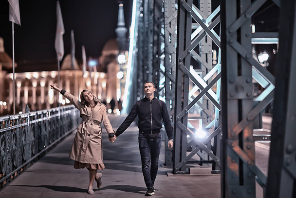 couple in love winter Budapest, tourism Hungary, a young couple a walk around the city in the evening - Foto, Bild