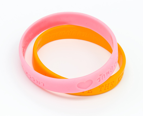 Armband aus gelbem und rosa Gummi - Foto, Bild