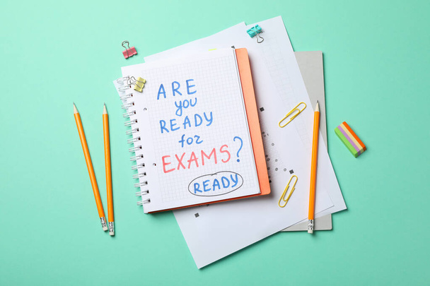 Inscription Are you ready for exams? Ready and stationary on mint background, top view - Photo, Image