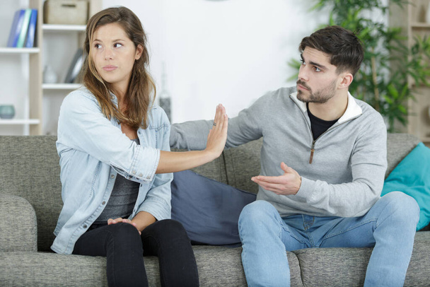 angry girlfriend making stop gesture to boyfriend - Photo, Image