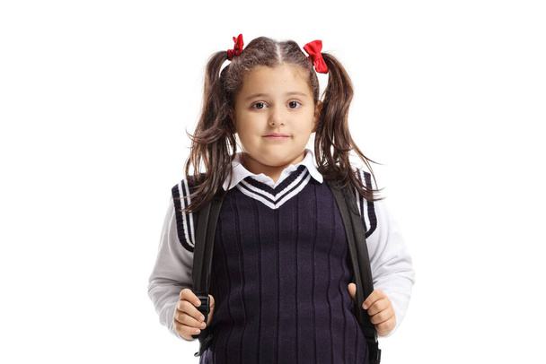 Girl in a school uniform and a backpack isolated on white background - Фото, зображення
