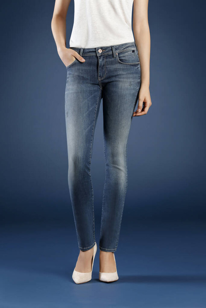 cropped view of woman posing in jeans in studio, fashion concept  - Foto, Imagem