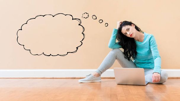 Blank speech bubble with woman using a laptop - Photo, image
