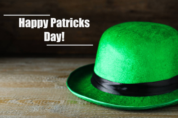 Green leprechaun hat on wooden table, space for text. St. Patrick's Day celebration - Φωτογραφία, εικόνα