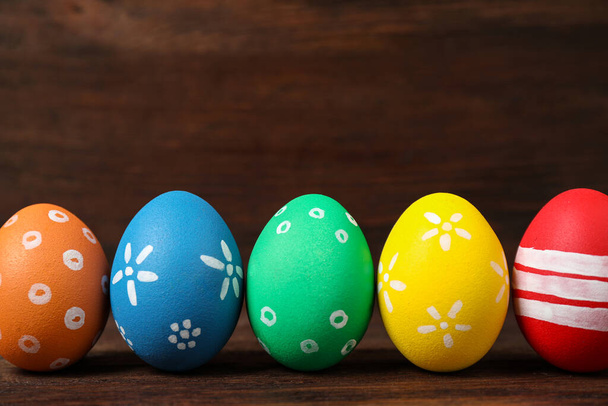 Colorful Easter eggs on wooden background. Space for text - Foto, Bild