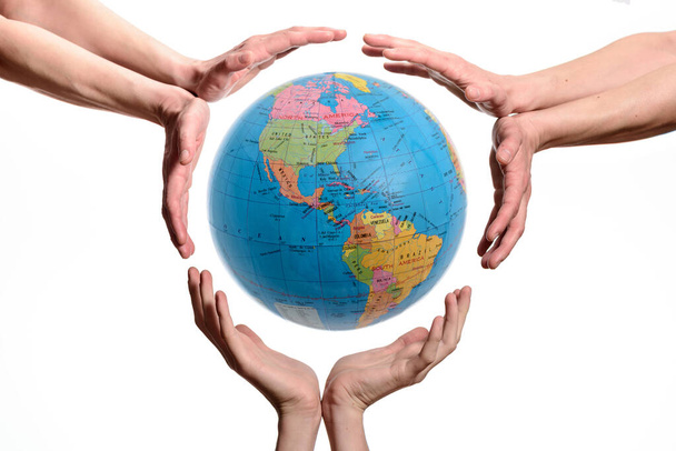 Hands Holding The Earth Globe. Concept image about to save or protect the planet, isolated on white background. - Фото, зображення
