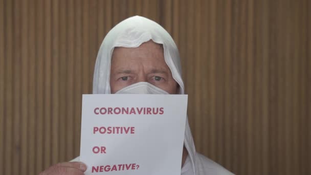 Pandemic protection of the Covid-19 coronavirus. Portrait of a mature Caucasian man in a medical face mask. Virus protection. Pandemic. Coronavirus. Covid-19. - Footage, Video
