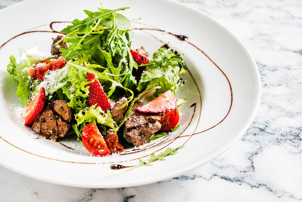 salad with strawberries and duck liver - 写真・画像