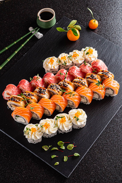 sushi set on the black background - Φωτογραφία, εικόνα