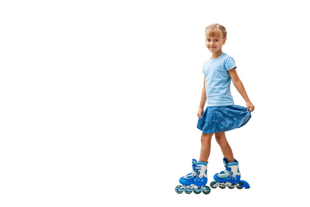Cute girl in roller skates on a white background - Photo, image
