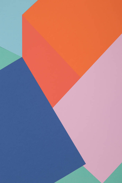 Blue, green, orange and pink background, colored paper geometrically divides into zones, frame, copy space. - Photo, image