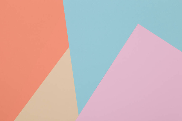 Blue, yellow, orange and pink background, colored paper geometrically divides into zones, frame, copy space. - Foto, Imagem