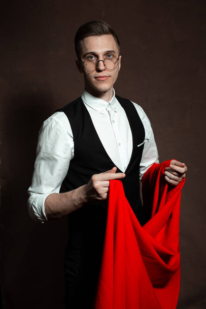 tailor man in round glasses with red cloth - Foto, immagini