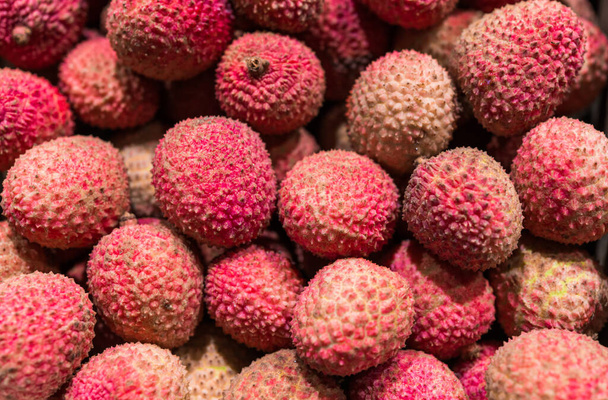Close up food photo of organic lychee exotic fruit at the farmers market stall. - Valokuva, kuva