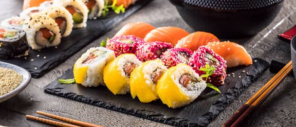 close-up view of delicious sushi set on slate board - Φωτογραφία, εικόνα