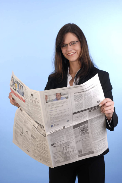 Young woman left newspaper - Fotó, kép