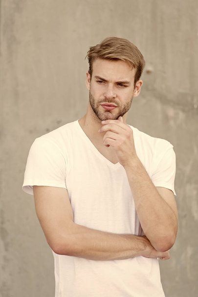 enjoy his style. young sexy guy gray background. unshaved macho man. summer male fashion. student unshaven face stylish hairstyle. Bearded man casual style. portrait of male attractiveness - Фото, изображение