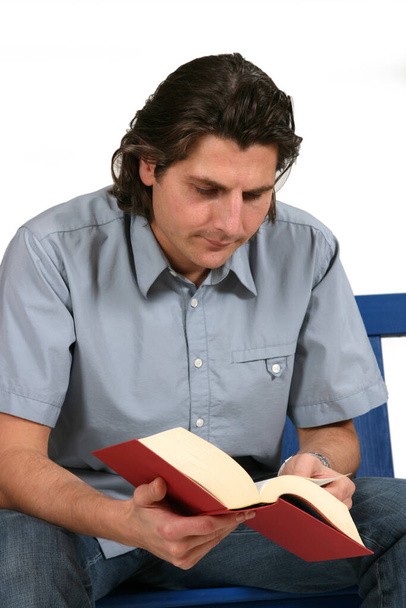 young man reading a book - Fotó, kép