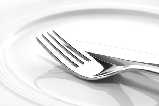 Silver cutlery and plates - Zdjęcie, obraz