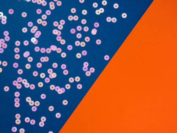 Pink dot circle confetti on blue orange background. - Zdjęcie, obraz
