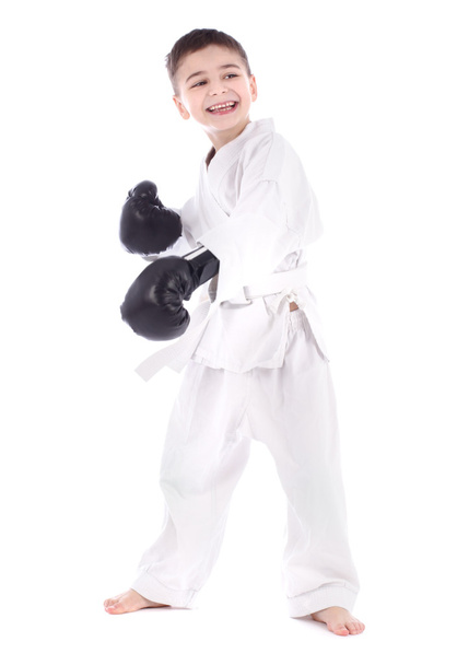 A young boy fighter in white kimono isolated on white background - Zdjęcie, obraz