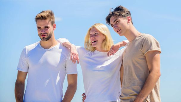 Being together. group of people outdoor. heaven concept. success heights. happy woman and two men. cheerful friends. friendship relations. family bonding and love. summer vacation. time to relax - Foto, immagini