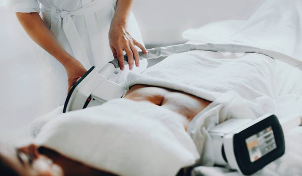 Caucasian lady having a cryolipolysis fat treatment procedure at the salon - Фото, зображення