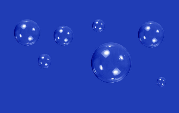 abstract blue soap bubbles on a black background - Photo, image