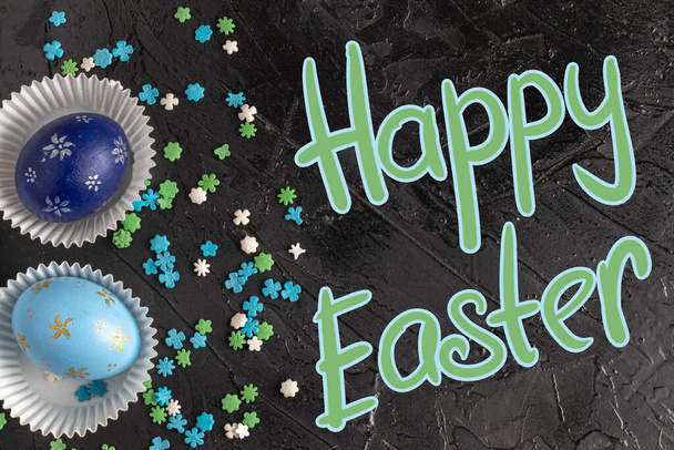 Colorful easter eggs on a dark background. Background with easter eggs. Top view. - Photo, Image
