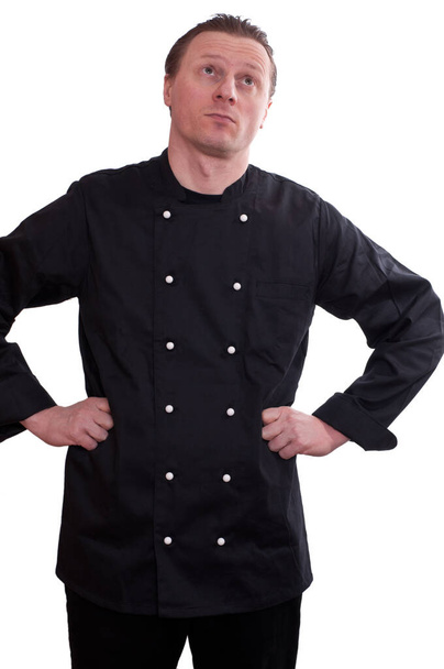 Чоловік як кухар дивиться вгору і заморожується
 - Фото, зображення