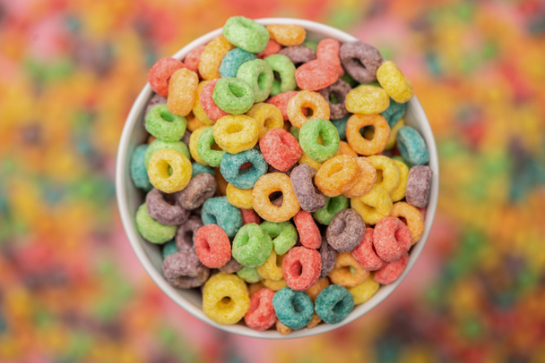 selective focus of bright colorful breakfast cereal in bowl - Fotoğraf, Görsel