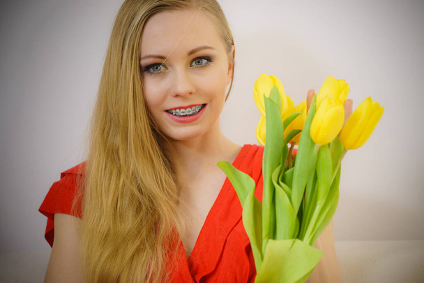 International women day, eight march. Beautiful portrait of pretty woman blonde hair with yellow tulips, fashion make up, elegant dress. Mothers day. - Fotografie, Obrázek