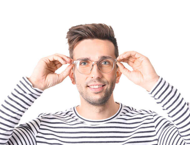 Young man with stylish eyeglasses on white background - Photo, Image