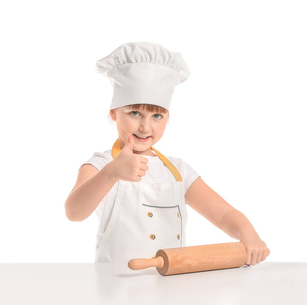 Cute little chef with rolling pin on white background - Фото, изображение