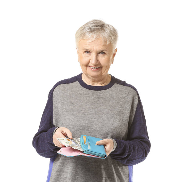 Senior woman with wallet on white background - Photo, Image