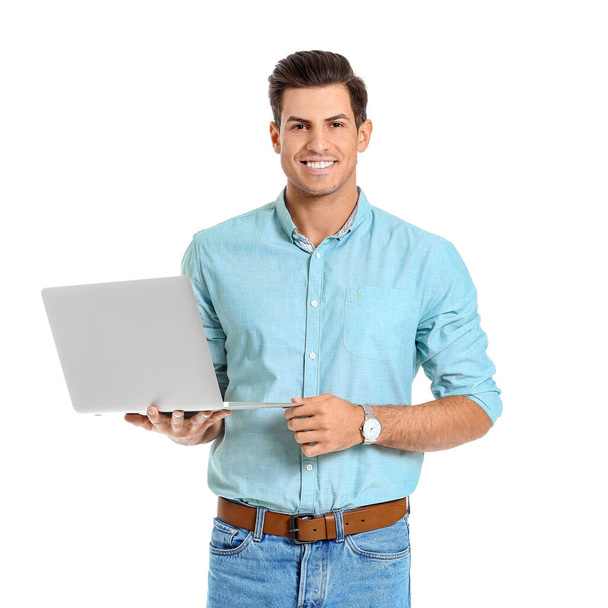 Handsome man with laptop on white background - Fotoğraf, Görsel