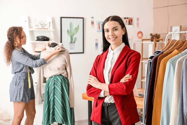 Portrait of female clothes stylist in office - Photo, Image