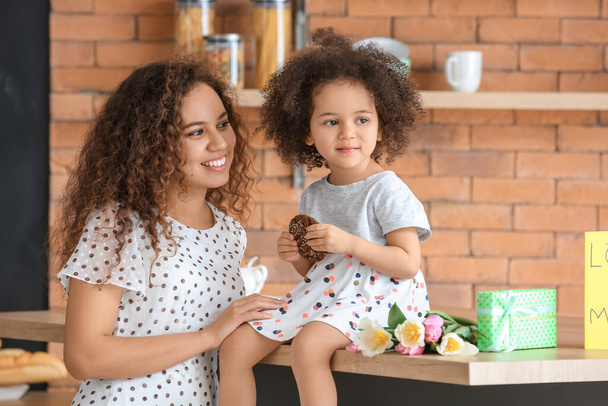 Little African-American girl with her mother at home - Photo, image