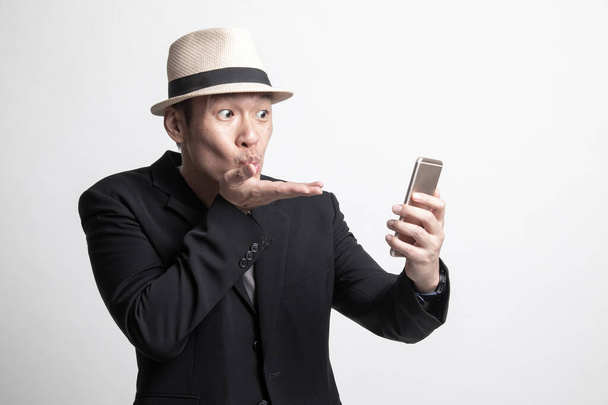 Adult Asian man  with mobile phone on white background - Photo, Image